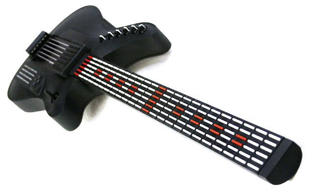 Fig 3: A MIDI guitar that uses buttons for note detection.